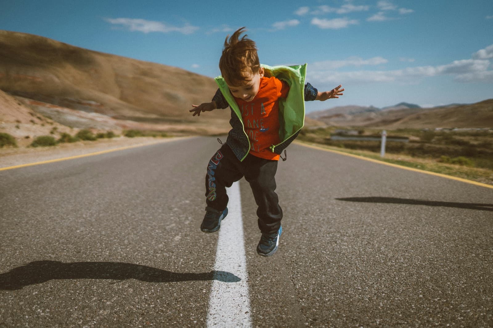 A boy jumping joyfully